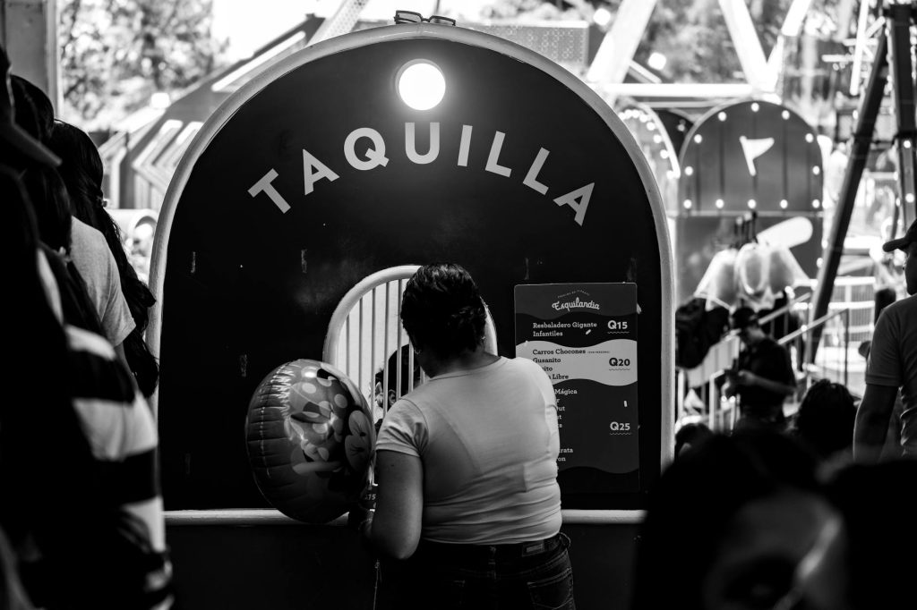 Black and white photo of a ticket booth in a Guatemalan amusement park.