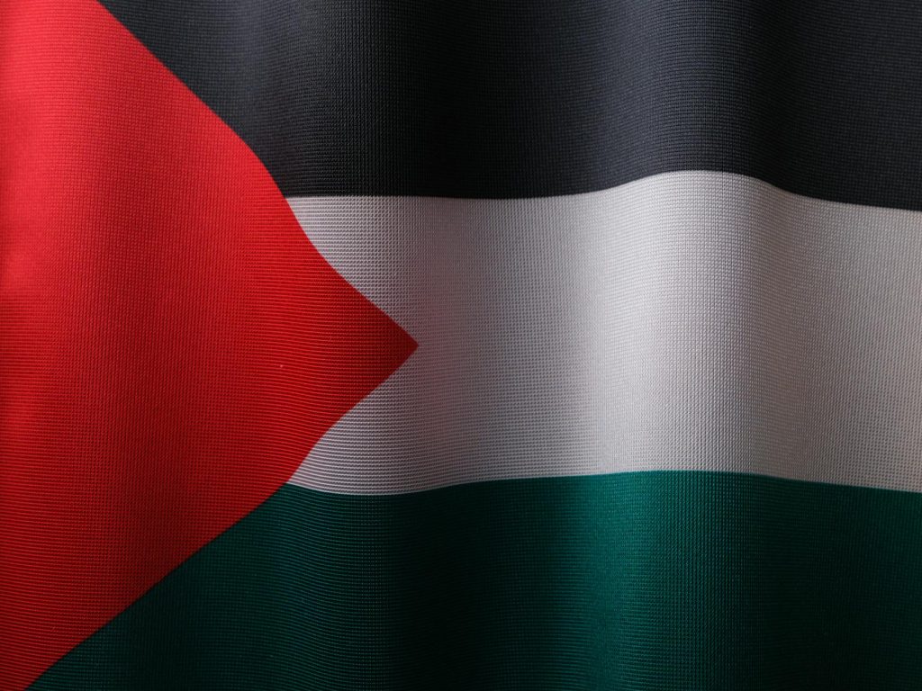 High-resolution close-up of the Palestinian flag showcasing its vibrant colors and textile texture.