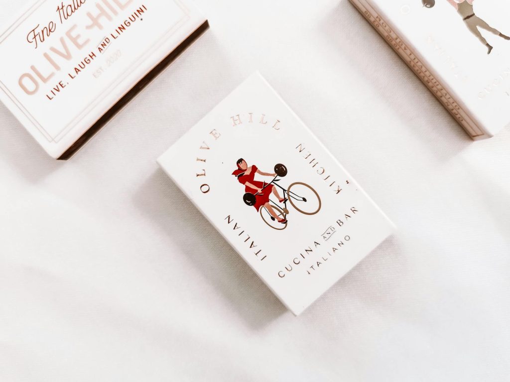 Elegant boxes with Italian branding displayed on a white background.