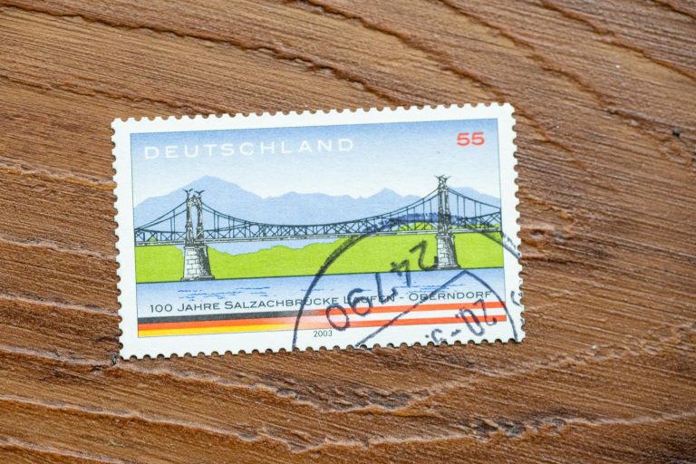 Vintage German stamp shows scenic bridge, highlighting design and postal history.