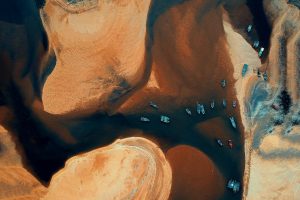 Stunning aerial view of vibrant boats on Kemasik river, Malaysia. Ideal for travel visuals.
