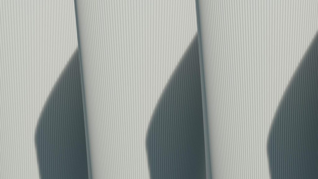 Abstract architectural image showcasing minimalist lines and strong shadows.