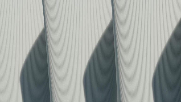 Abstract architectural image showcasing minimalist lines and strong shadows.