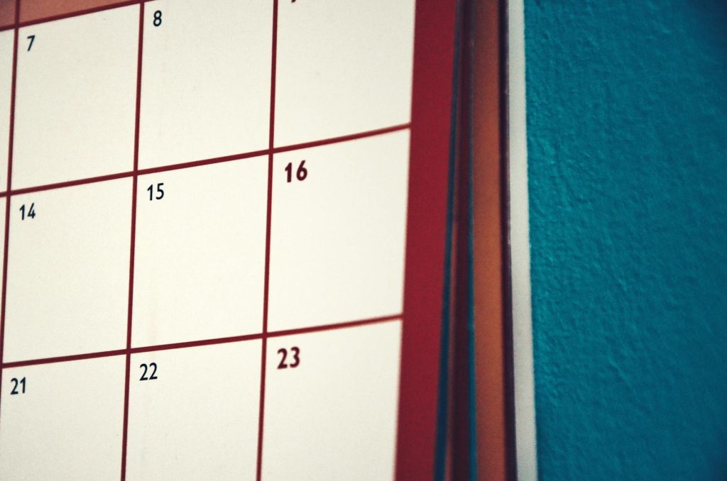 A minimalist calendar hanging on a colorful wall, perfect for planning and organization.