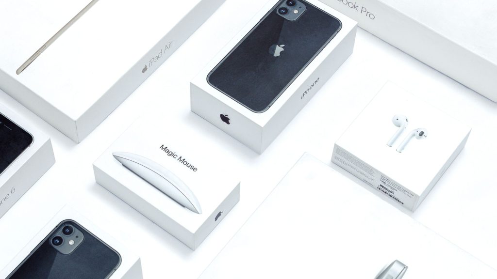 Flat lay of assorted Apple product boxes showcasing technology packaging design.