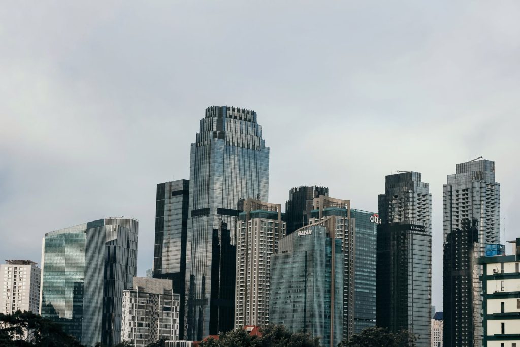 Stunning view of modern skyscrapers in Jakarta, Indonesia under a cloudy sky.